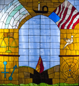 UUFC member Nikki Rohrs created this stained glass, which illustrates the Seven Principles of Unitarian Universalism.